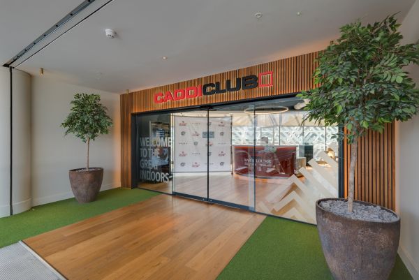Caddi Club and 54 Take a Swing at Reshaping London’s Golf Scene The entrance to Caddi Club Wimbledon, one of four state-of-the-art venues offering a premium indoor golf experience across London.